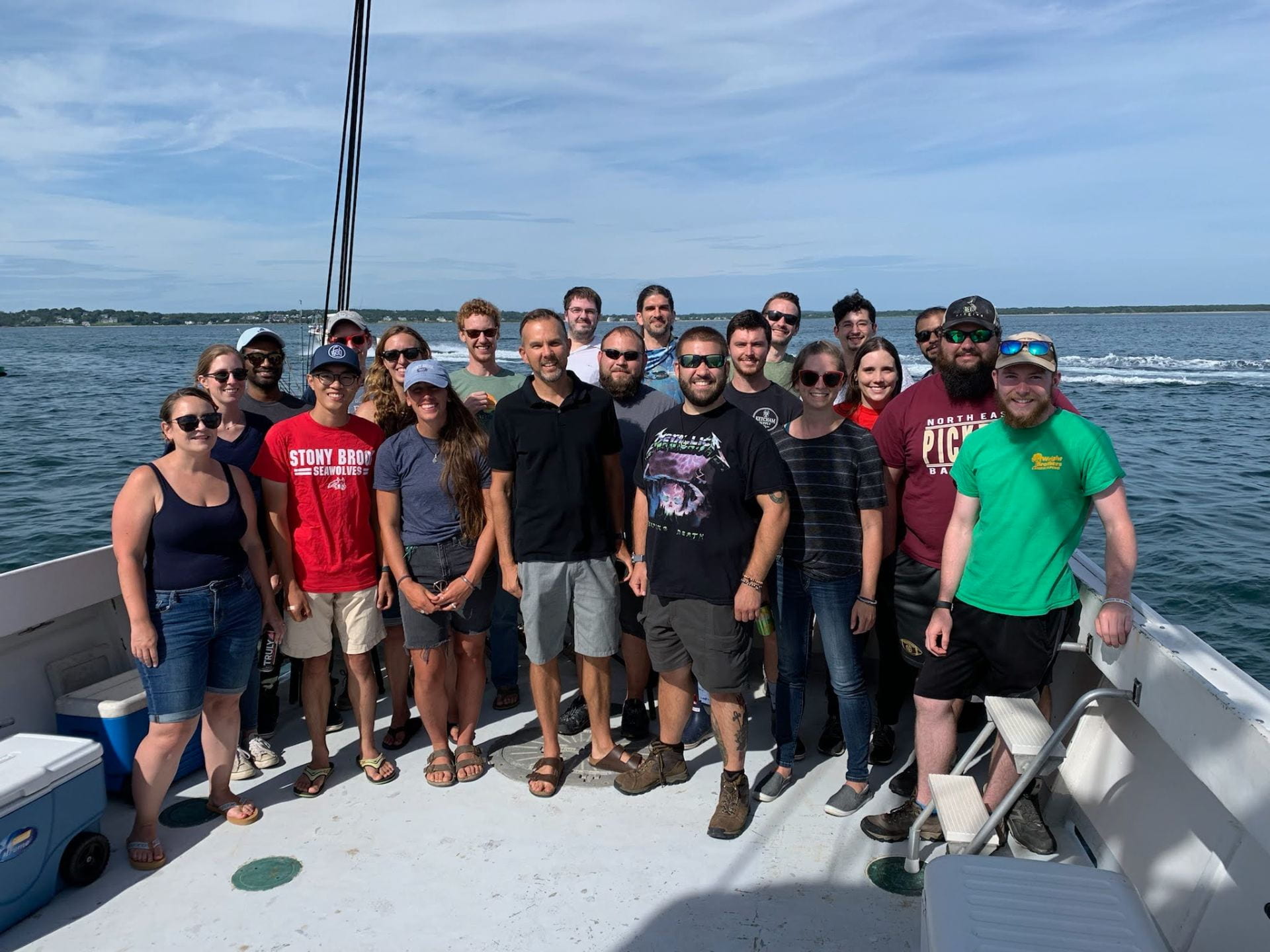 Our lab group standing on a boat during our annual lab fishing trip