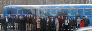 SoMAS Faculty, Staff and Students with the new SoMAS-themed bus