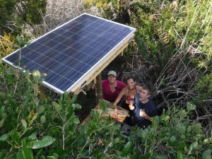 Emily, Paula and Ron with the first solar panel up! 